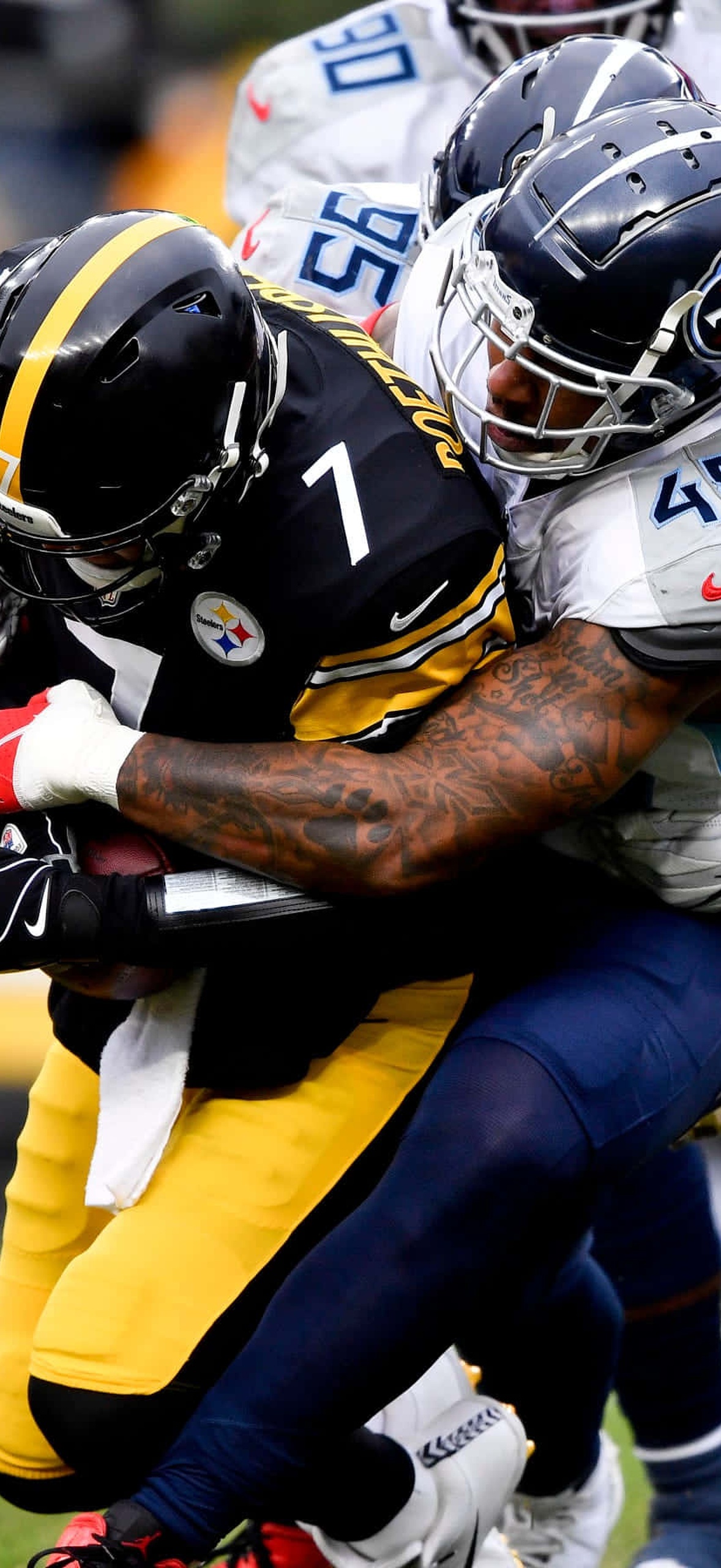 Football player tackled by opponent during game