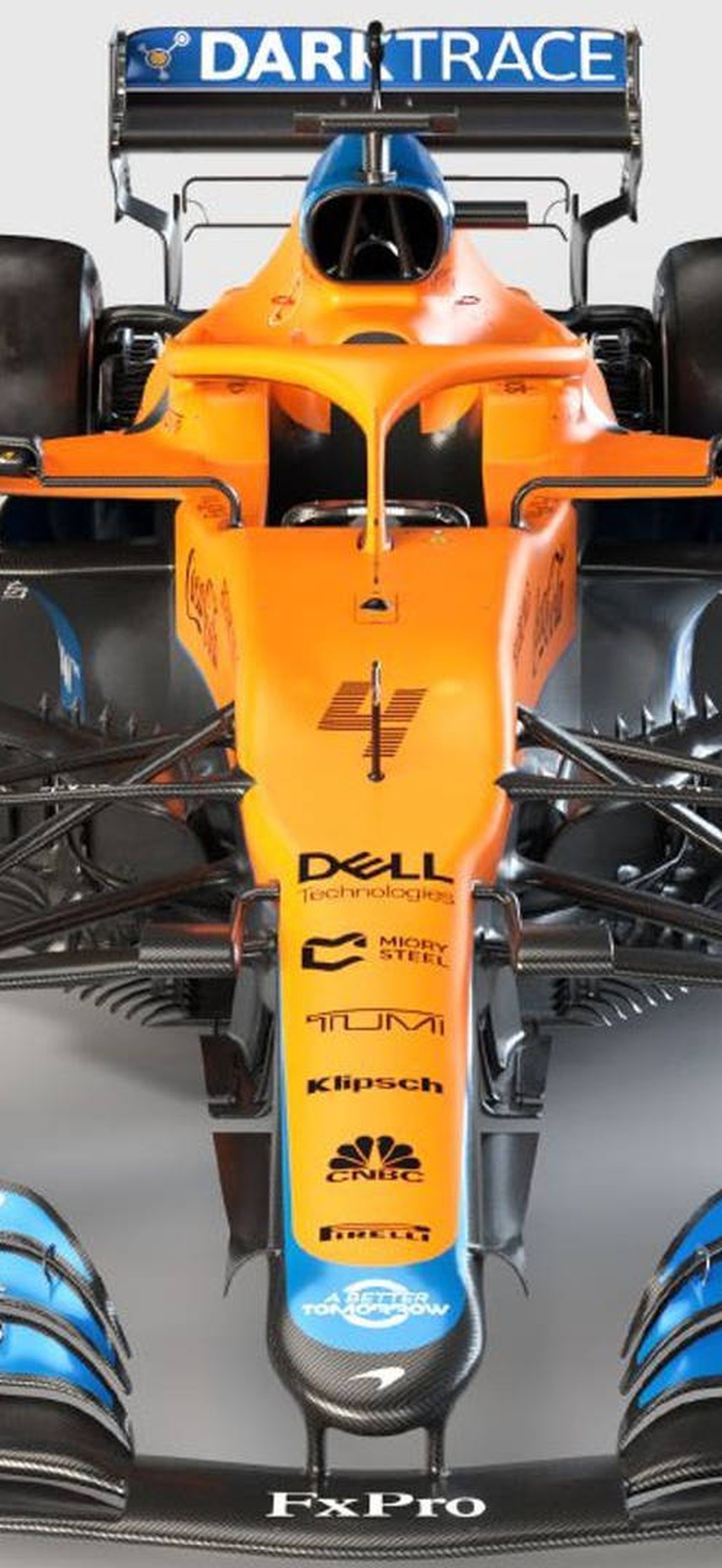 Orange and blue Formula 1 race car with sponsor logos viewed from above.