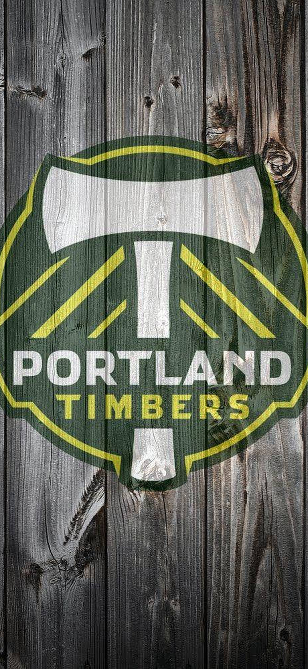 Portland Timbers soccer team logo on dark wood background
