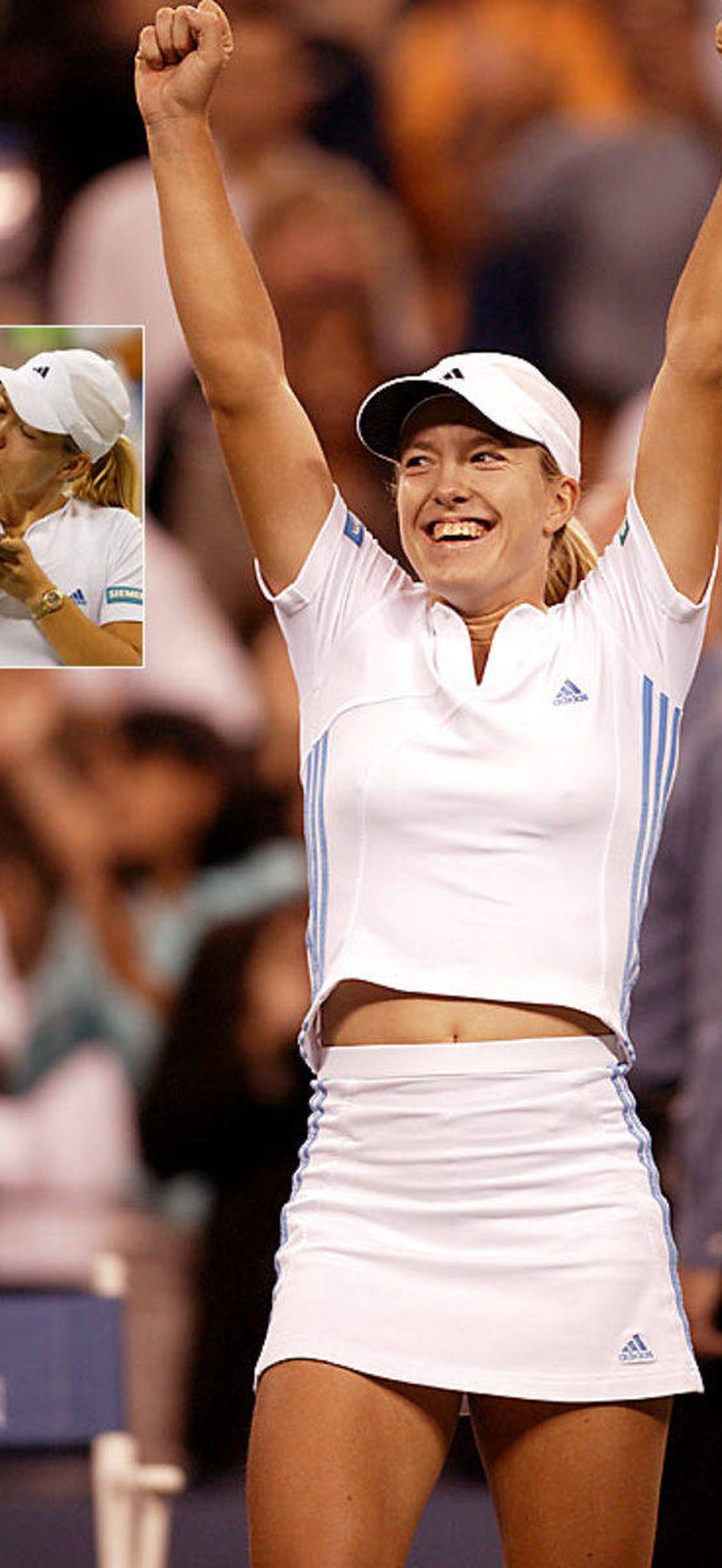 Tennis champion raises fists in triumph after winning a major tournament.